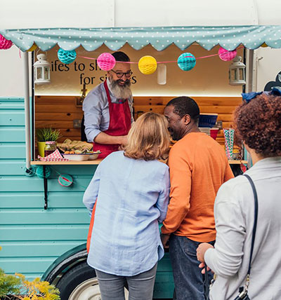Man with hard hat using a laptop